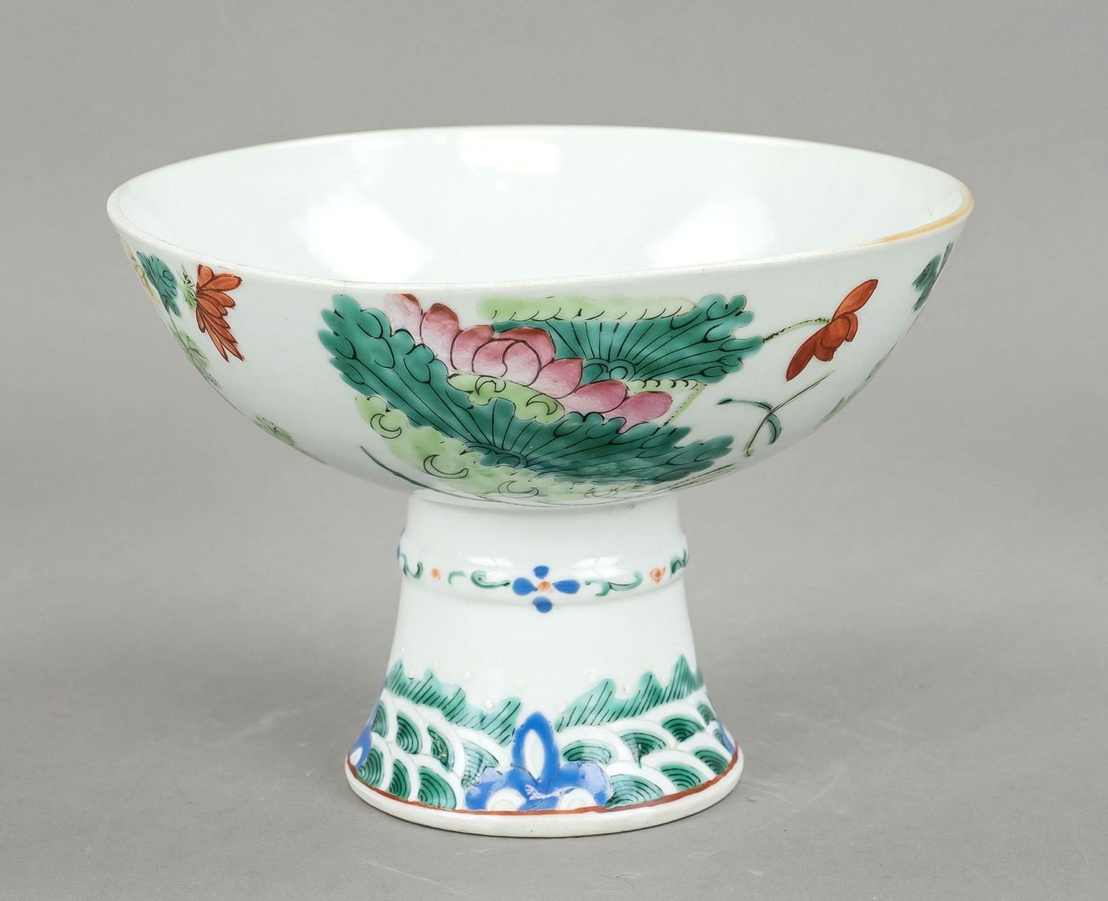 Large porcelain goblet ''The S: Large porcelain goblet ''The Seasons Flowers'', China, 19th/20th c., porcelain bowl on high foot with polychrome glaze decoration, peony/photos/chrysanthemum/plum blossom, hairline crack, h 12cm d 16.