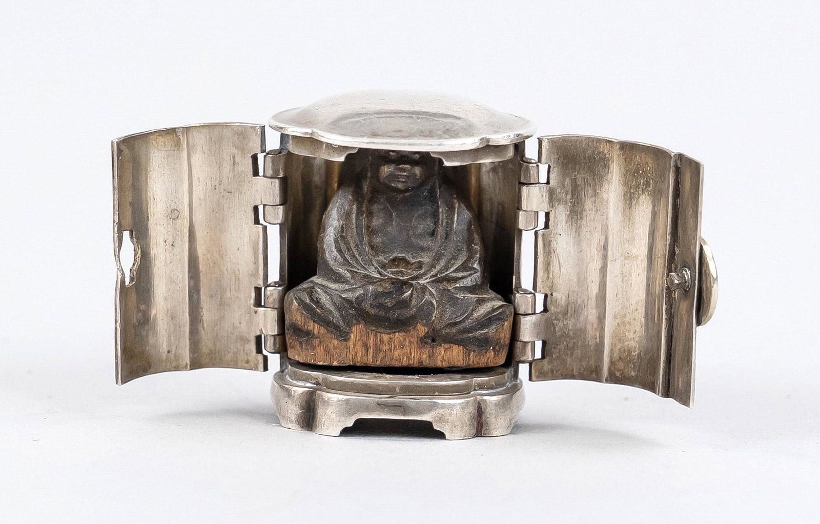 Miniature shrine (jap. zushi): Miniature shrine (jap. zushi) with Daruma, Japan, probably Meiji period (1868-1912) 19th century, small four-pass silver shrine with hinged doors and crest clasp, inside wooden figurine of Bodhidharma