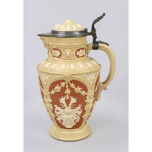 Jug with pewter lid mounting, Ge: Jug with pewter lid mounting, Germany 19th/20th c. Circumferentially decorated with a relief as an arch architecture with garlands and heraldic cartouches. Marked ''Villeroy & Boch Mettlach'' under th