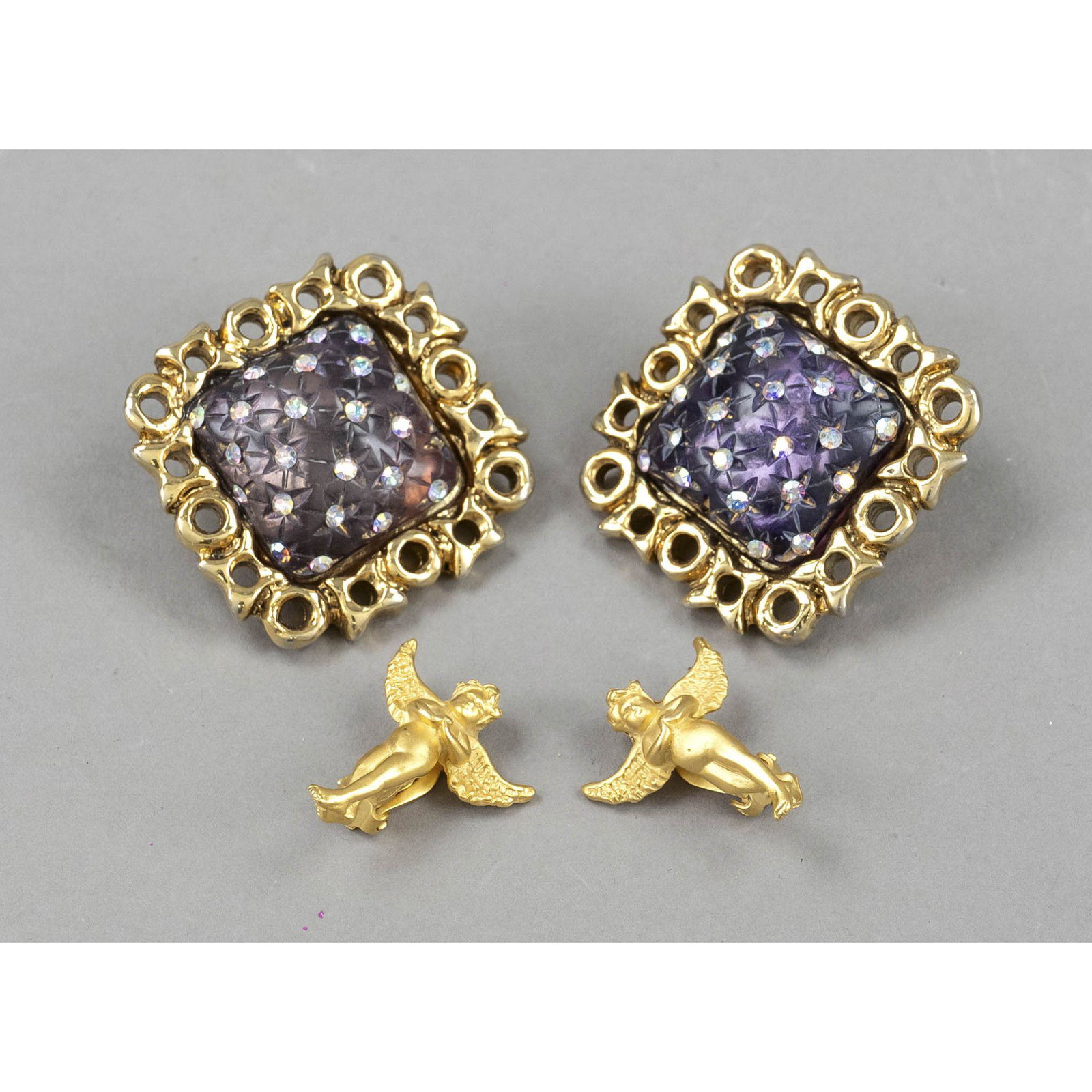 Two pairs of vintage costume jew: Two pairs of vintage costume jewelry ear clips, one pair of large cushion shaped clips with gemstone trim by Claire Deve, Paris, and one pair of small gold colored angel figurines, some slightly rubbe