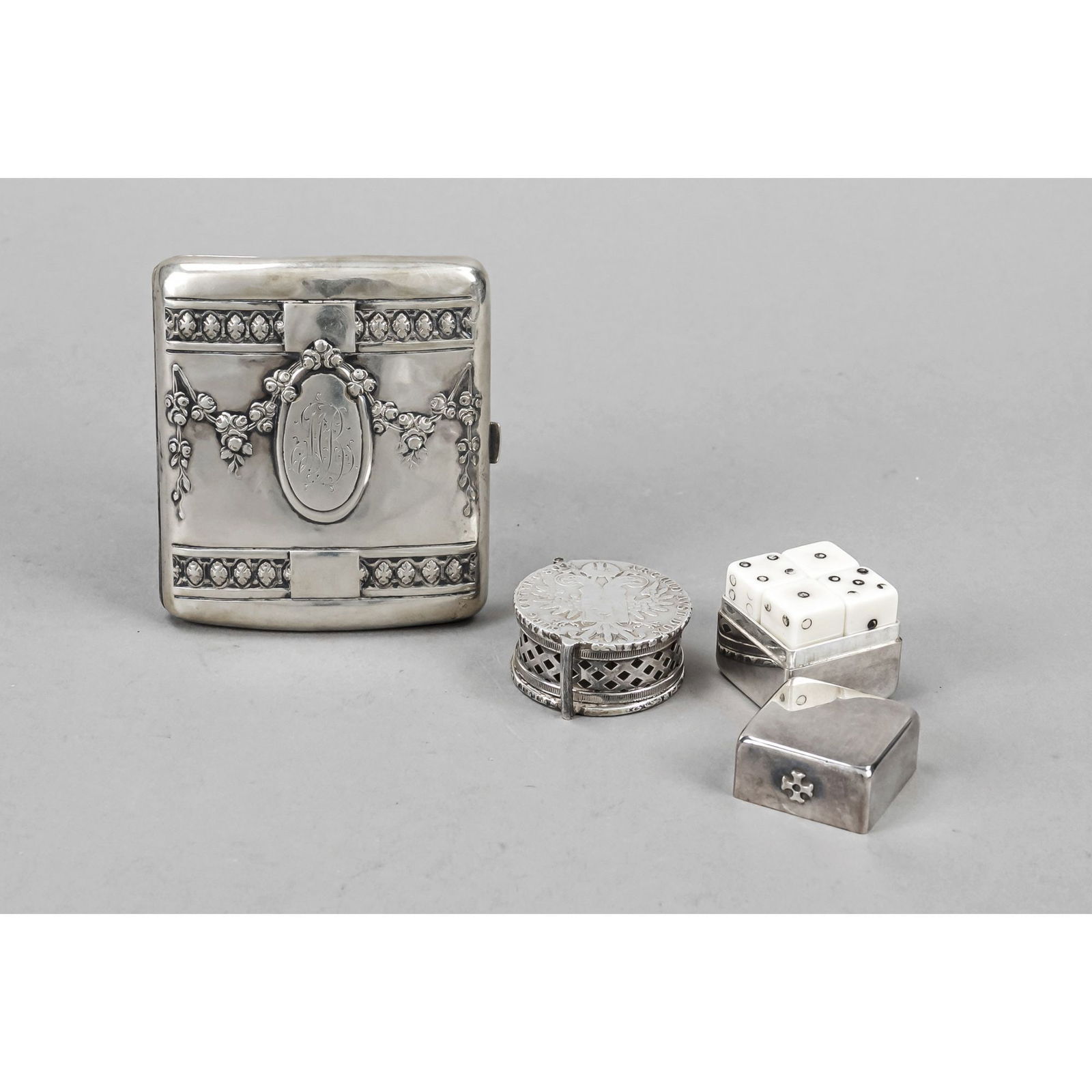 Set of three pieces, cigarette ca: Set of three pieces, cigarette case, German, early 20th c., silver 800/000, rectangular domed shape, lid with floral and ornamental relief decoration and monogram, l. 9 cm, ca. 79 g, round pill box, O