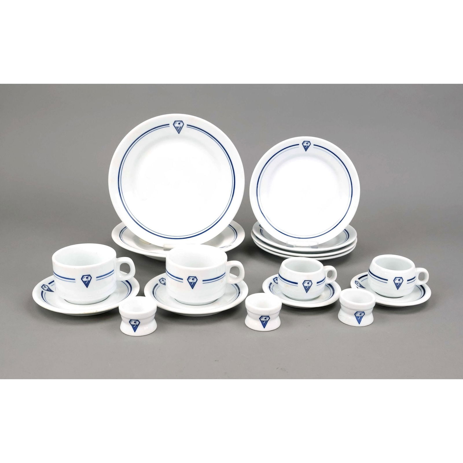 33 pieces of tableware of an un: 33 pieces of tableware of an unidentified shipping company or ship, ''Jadrol'', probably Polish, end of 20th c., white porcelain with logo, plates in four sizes, coffee cups, egg cups, etc., rubbed di