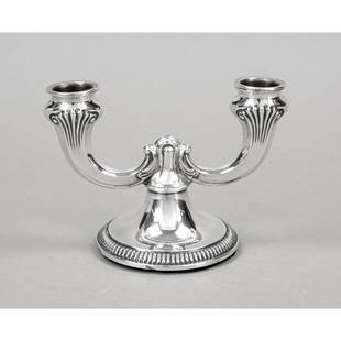 Two-light candlestick, German, 2nd half: Two-light candlestick, German, 2nd half 20th century, master's mark Gottlieb Kurz, Schwäbisch Gmünd, silver 835/000, round domed and filled stand, 2 curved arms, wall with relief decoration, l. 15 c