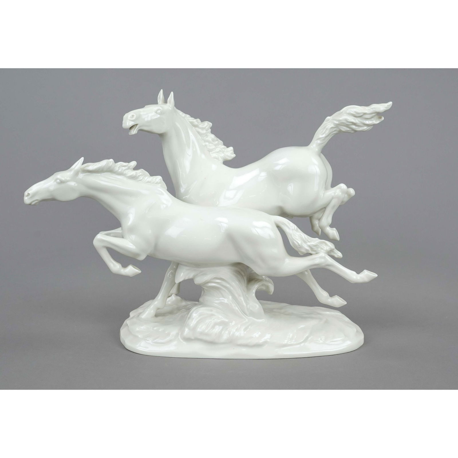 In Freiheit, Hutschenreuther, Selb: In Freiheit, Hutschenreuther, Selb, mark of the art department 1955-69, design M.H.Fritz, inscribed in the base, galloping pair of white horses, 30 x 40 x 14 cm
