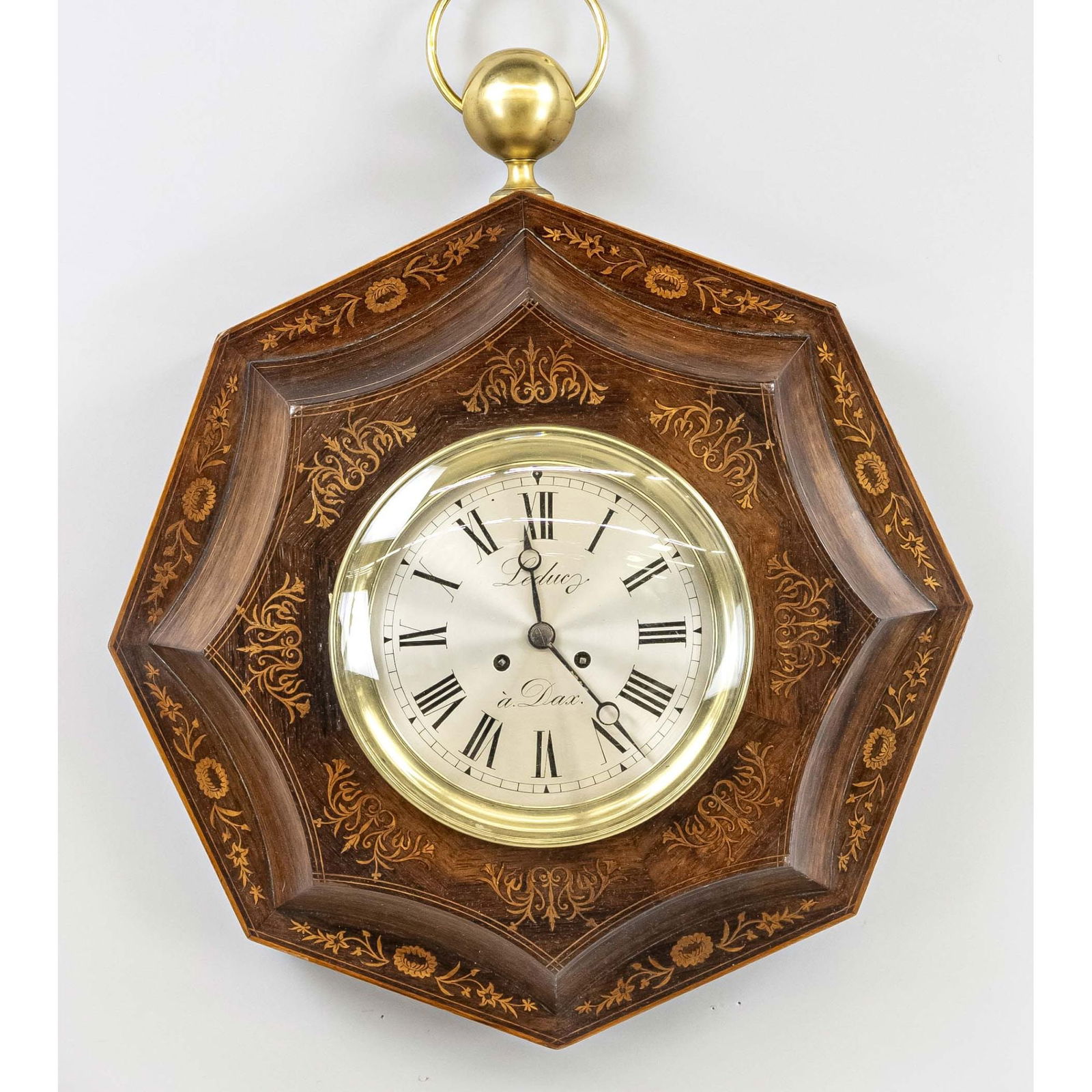 7-cornered large wooden wall cl: 7-cornered large wooden wall clock with many floral and ornamental light inlays, also thread inlays all around, silvered dial with black Roman numerals and blued Breguet hands, marked 'Leduc a Dax', F