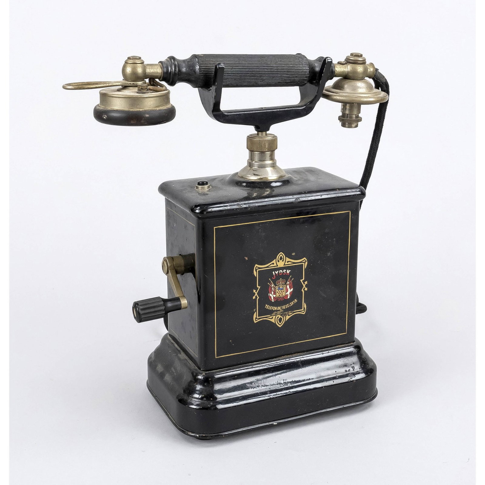 Historic telephone, Denmark, c.: Historic telephone, Denmark, c. 1900, iron, painted black, printed logo, the receiver is missing the mouthpiece, slightly rubbed, h. 30 cm