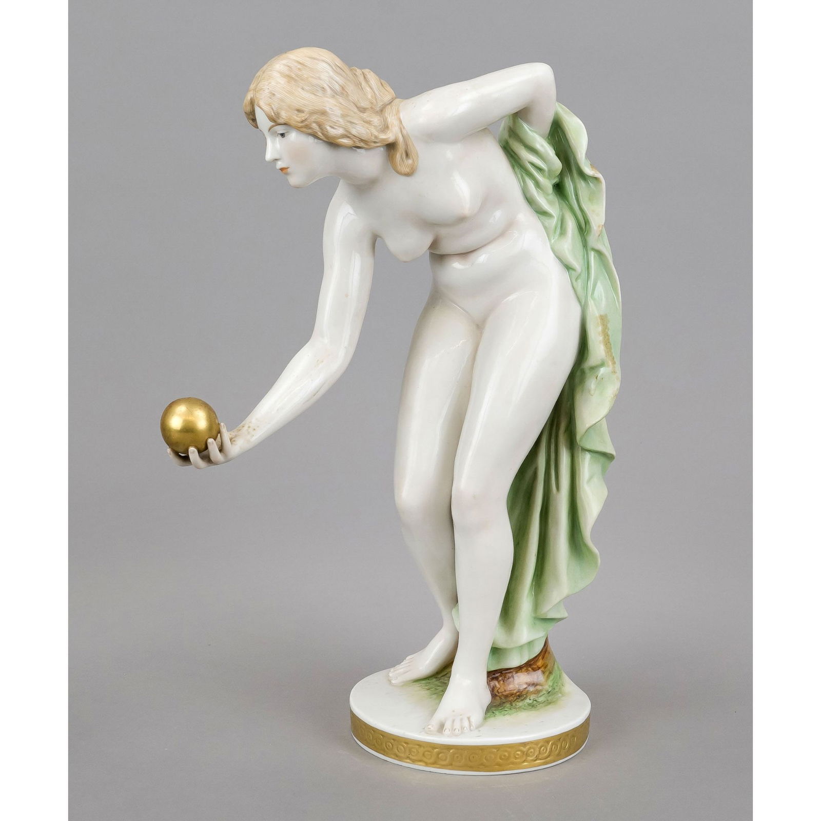 Ball player, Scheibe-Alsbach, Thu: Ball player, Scheibe-Alsbach, Thuringia, 20th century, After the Meissen model by Walter Schott. A standing, unclothed, leaning girl holding a golden ball in her right hand on a gold-studded, round pl
