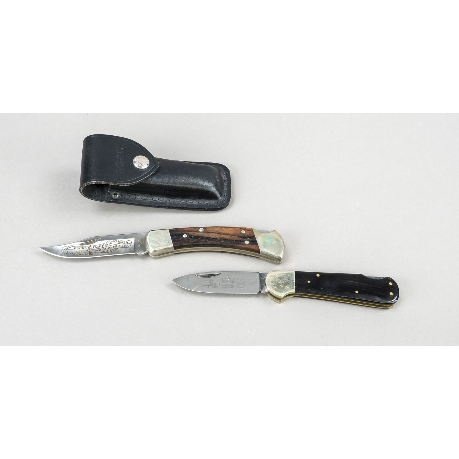 2 Pocket Knives Hunting Knives, 2n: 2 Pocket Knives Hunting Knives, 2nd half 20th century 1 x Buck model 110NK, on the blade ''Buck's Famous Folding Hunter 1963 - 1988'', in original leather sheath and box. In addition a folding knife k