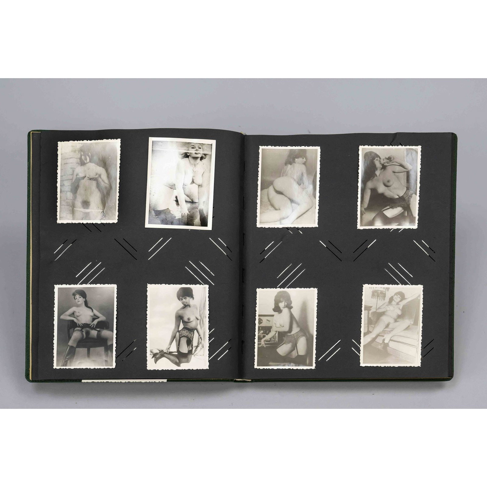 Photo album erotic, ca 1960s. Stoc: Photo album erotic, ca 1960s. Stock album with approx. 50 mostly glued-on explicit bw photos of ladies and gentlemen enjoying themselves and posing as a couple, in a group or alone. Photos mostly 7 x 
