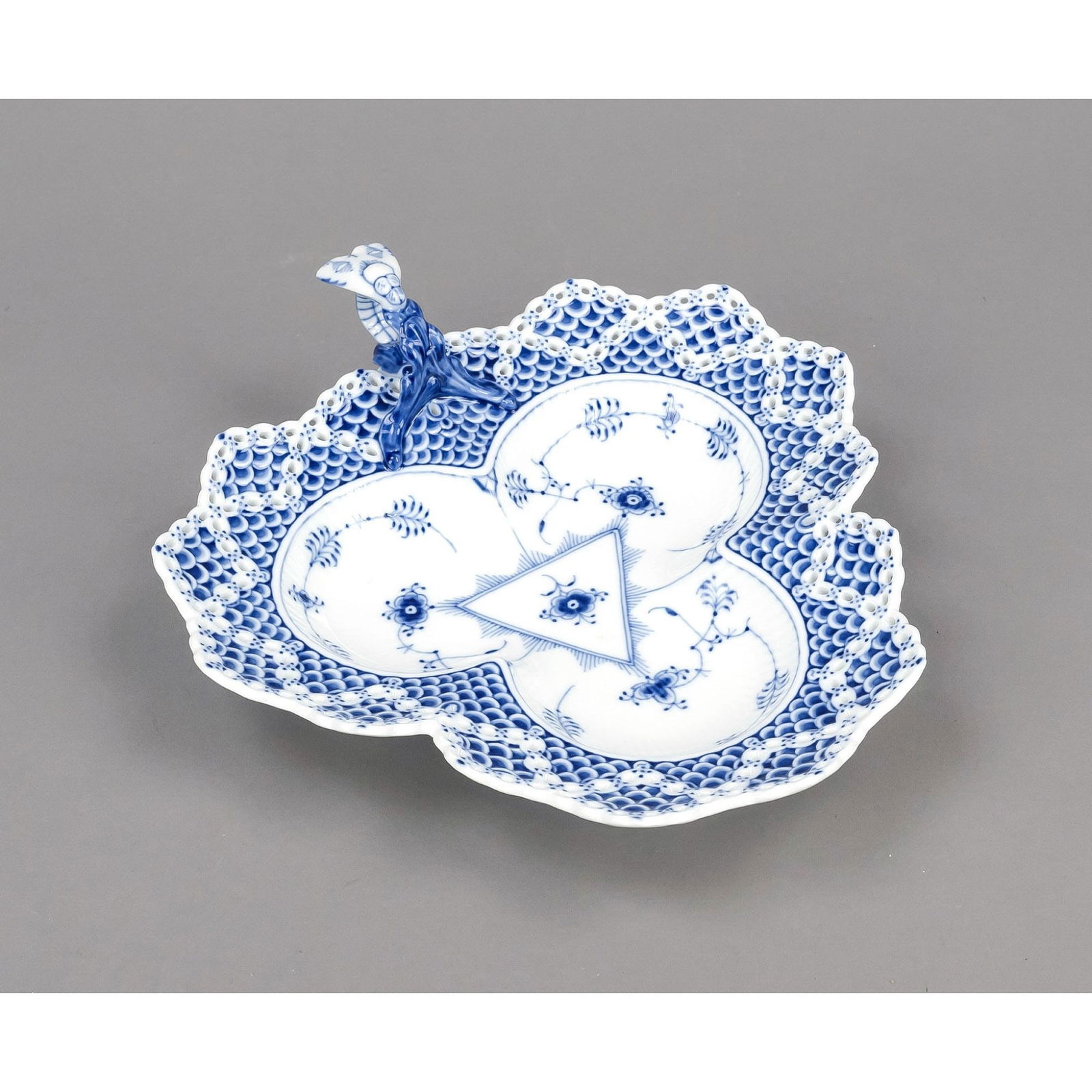 Leaf bowl, Royal Copenhagen, Denmark, st: Leaf bowl, Royal Copenhagen, Denmark, stamp mark 1985-1991, designed by Arnold Krog in 1885, Musselmalet, model no. 354, trefoil form with wide, partly openworked rim, a branch handle with sculptural