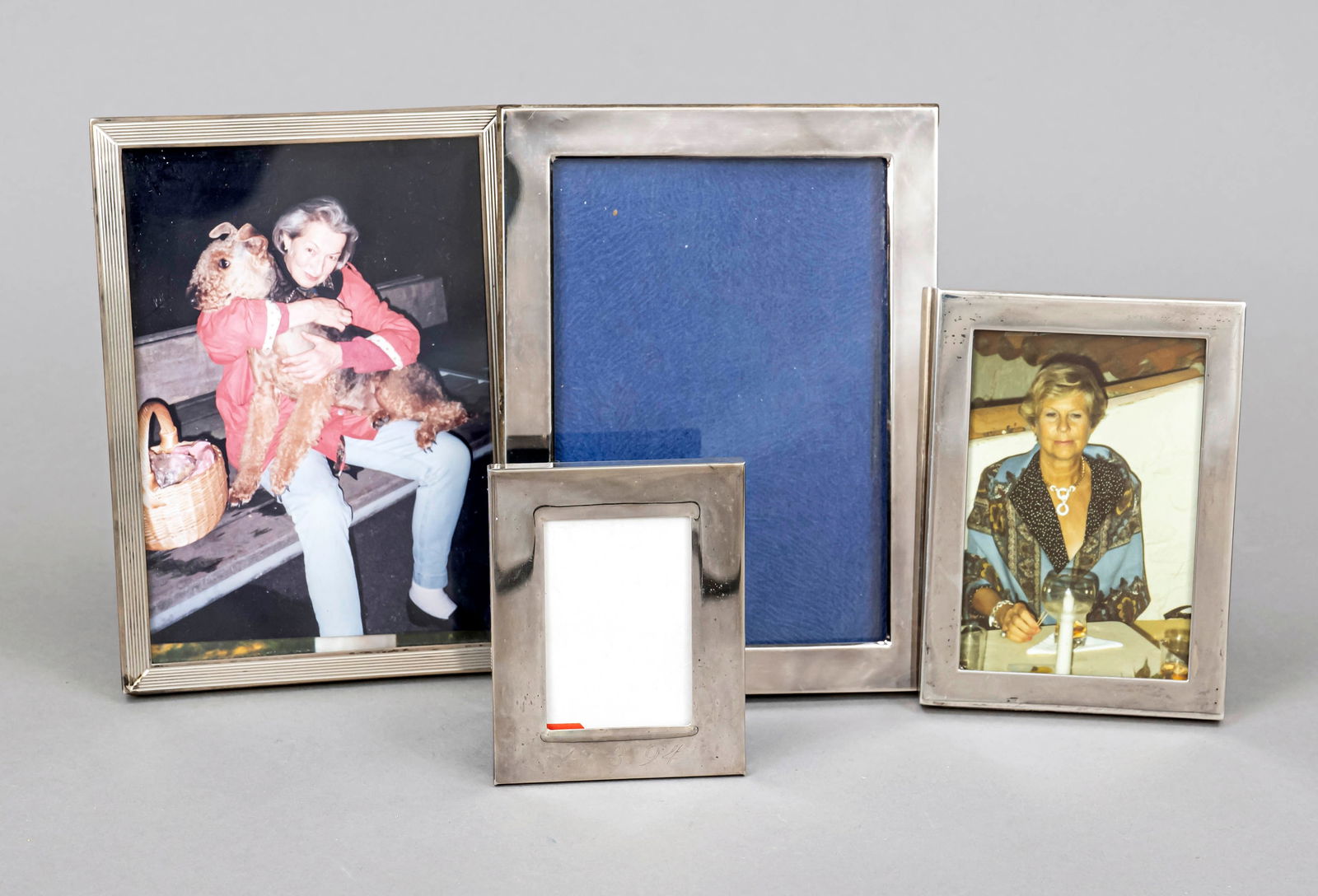 Four rectangular photo frames, 2nd hal: Four rectangular photo frames, 2nd half of the 20th century, 3x silver of various finenesses, 1x plated, smooth form, 1x molded, clear dimensions up to 13 x 9 cm, overall dimensions up to 15.5 x 11.5