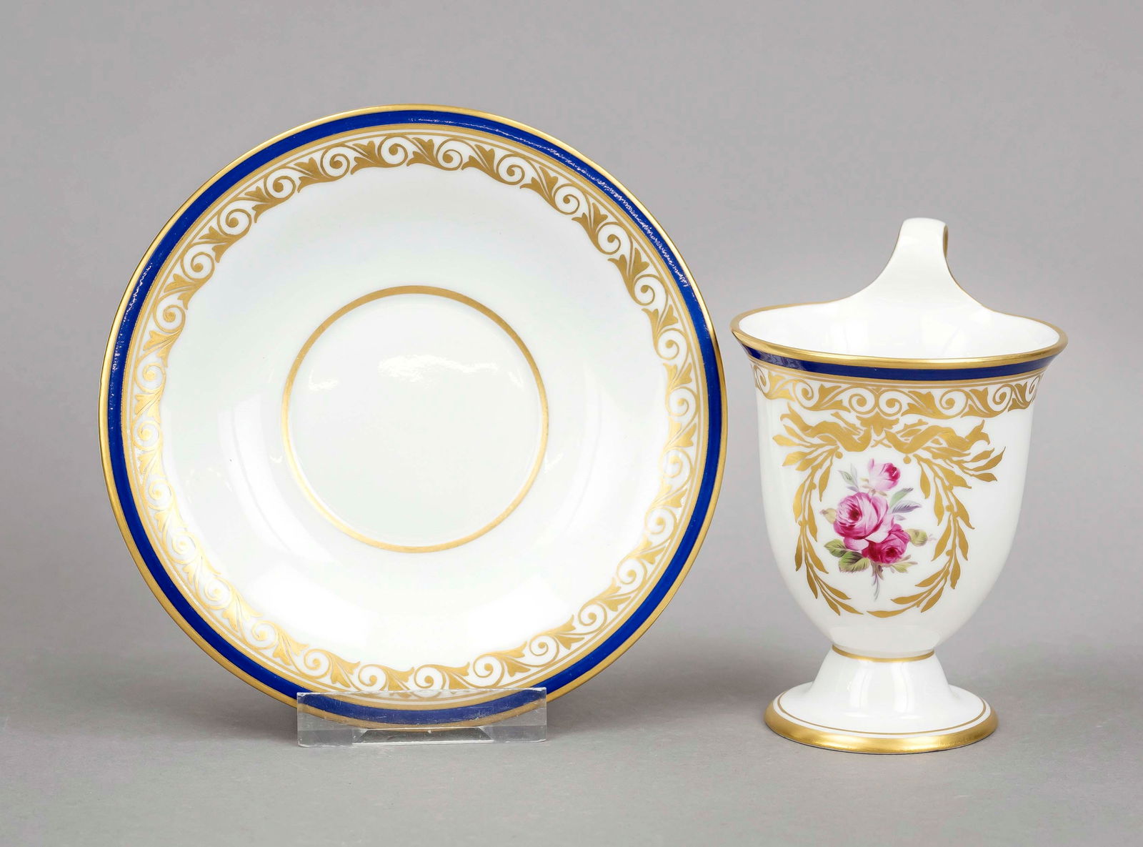 Cup and saucer, KPM Berlin, mark 1870-: Cup and saucer, KPM Berlin, mark 1870-1945, 1st choice, red imperial orb mark, year mark for 1923, bell-shaped cup with campanile handle, polychrome painting with rose bouquet framed by a gold laurel