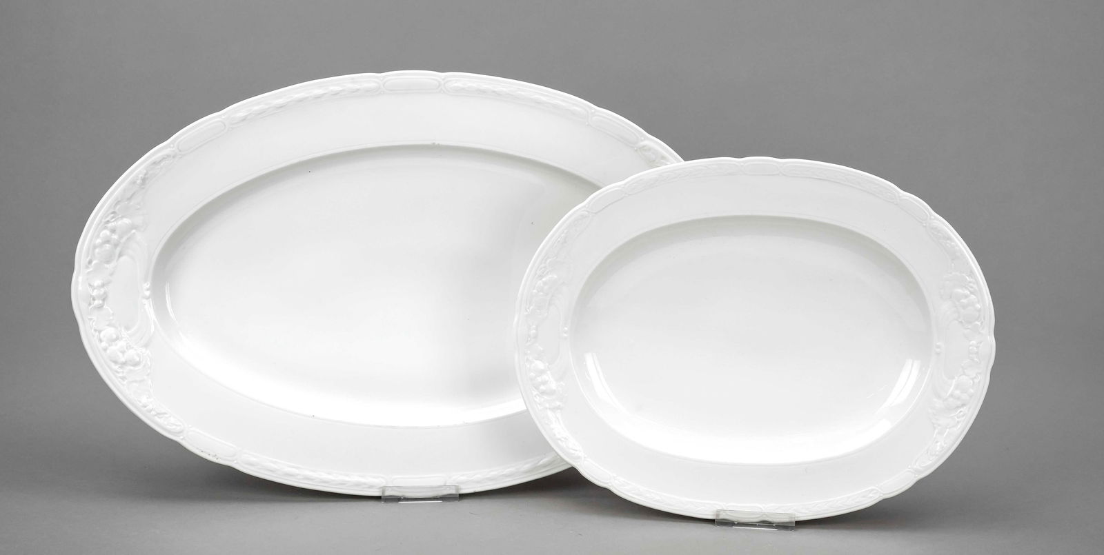Two oval Art Nouveau serving platters,: Two oval Art Nouveau serving platters, KPM Berlin, marks 1870-1945 (1x cut out), 2nd choice, 1x war mark, year mark for 1918 and 1920, artist's signet TSB, shape Ceres, designed by Theodor Schmuz-Baud