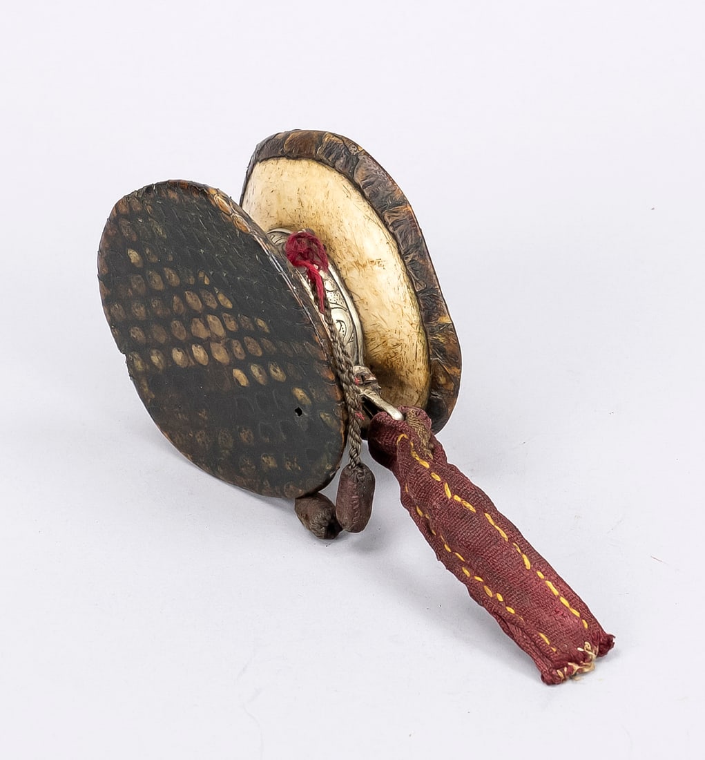 Damaru, Tibet, probably 18th/19th cent: Damaru, Tibet, probably 18th/19th century, skull fragments, python skin and decorated paktong mount. Skin with small crack, d. 10 cm