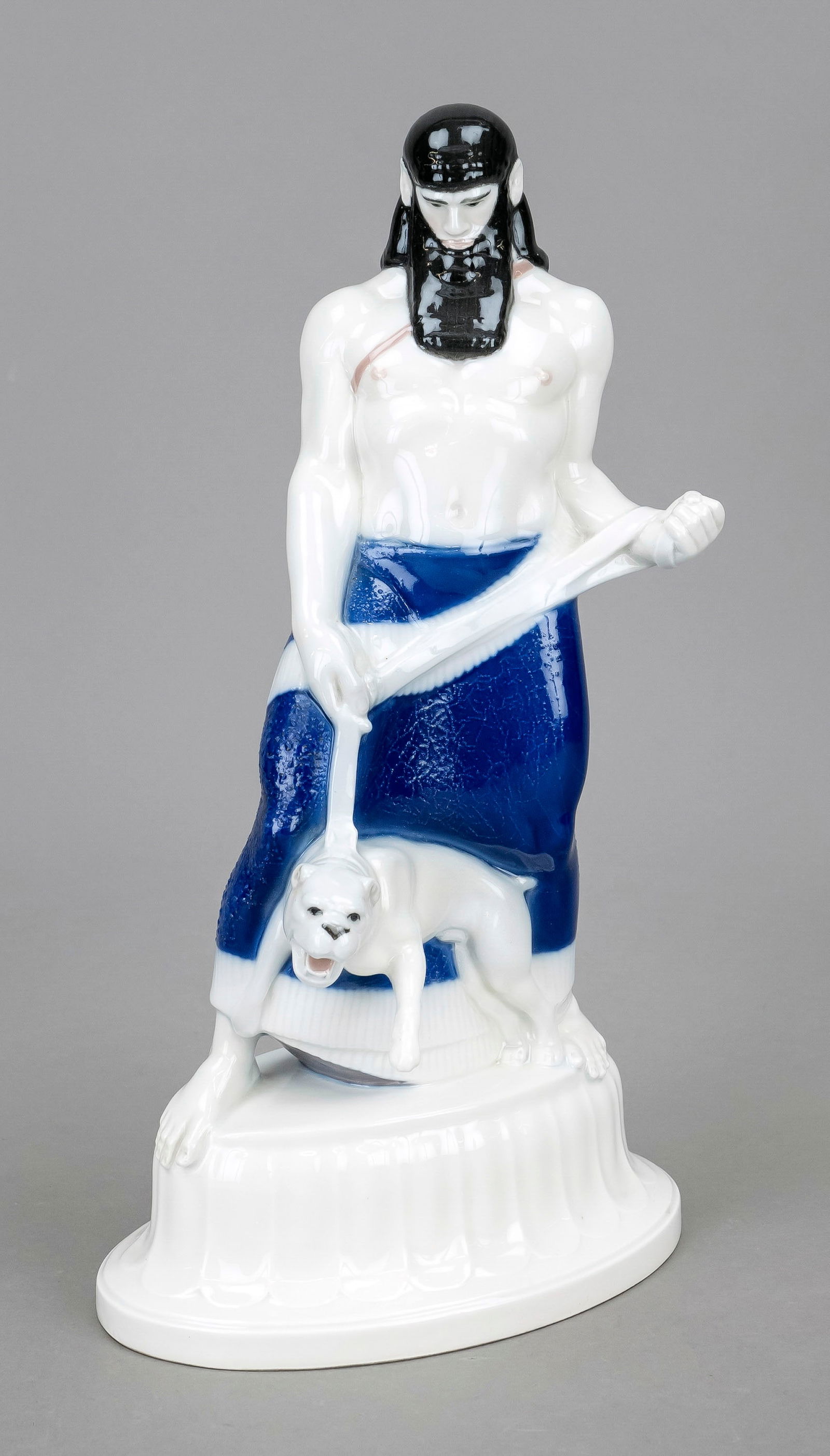 Assyrian with dog, KPM Berlin, ma: Assyrian with dog, KPM Berlin, mark pre-1945, year letter for 1919, 2nd choice, blue imperial orb mark, model no. 9614, on an oval base with relief decoration, inscribed Amberg on the base, design by