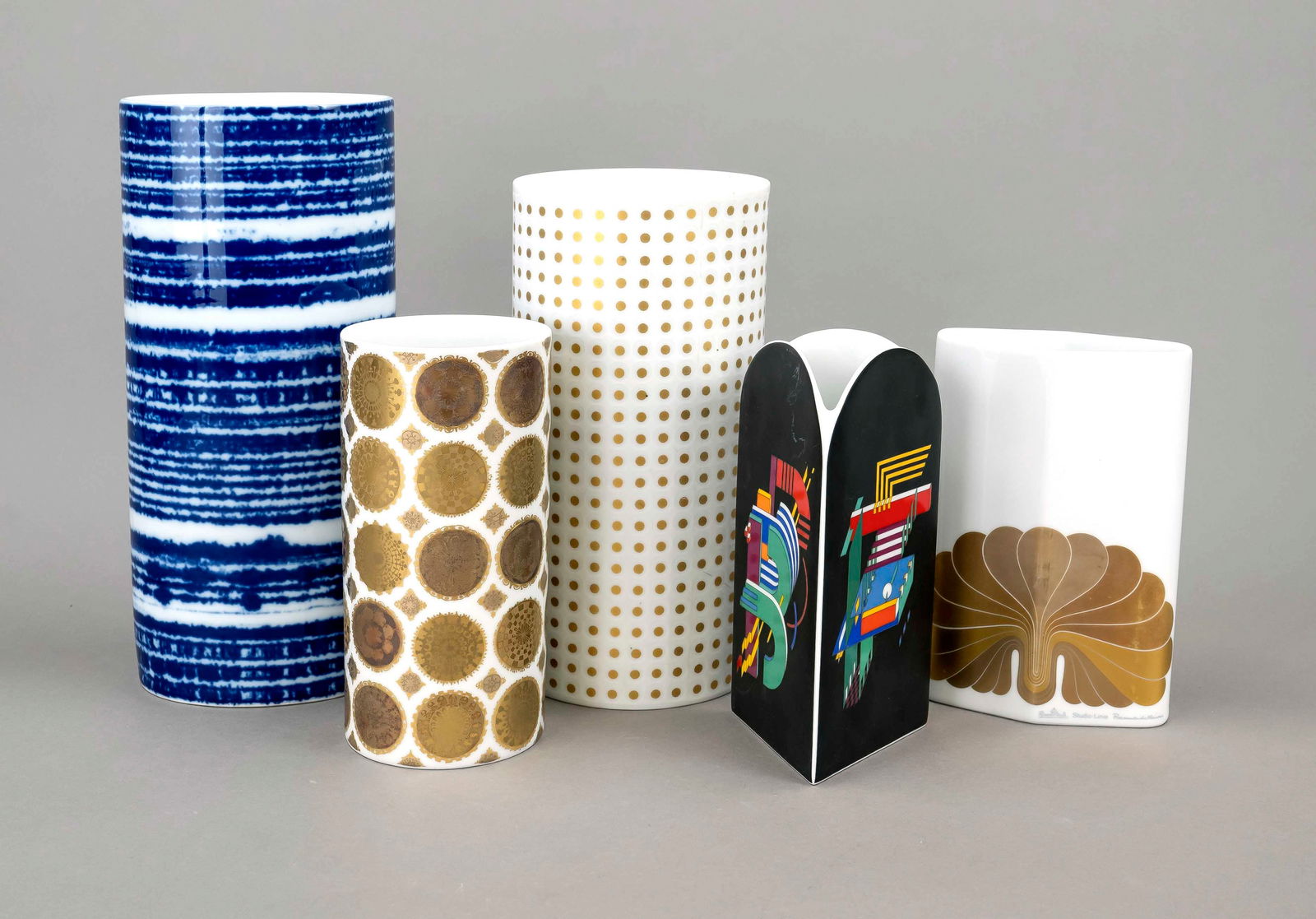 Five vases, Rosenthal, studio lin: Five vases, Rosenthal, studio line, 20th century, various shapes, decorations and sizes, 3x white with gold decoration, 1x underglaze blue, 1x polychrome, designs by Marcello Morandini (1940 Mantua) a