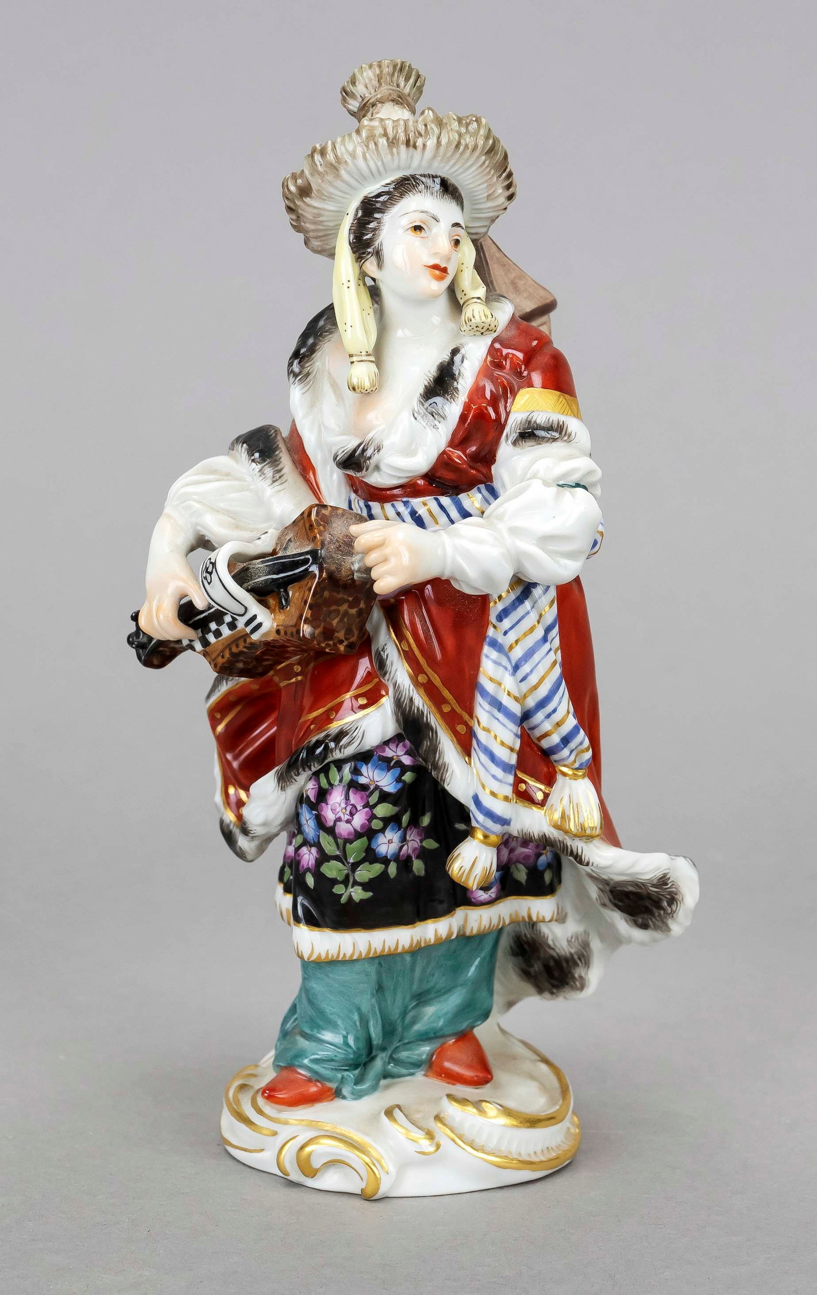 Malabarine with hurdy-gurdy, Meis: Malabarine with hurdy-gurdy, Meissen, c. 1980, 1st choice, after a design by Friedrich Elias Meyer, c. 1755, model no. 67036, polychrome painting and ornamental gilding, on a rocaille base, chipped, h