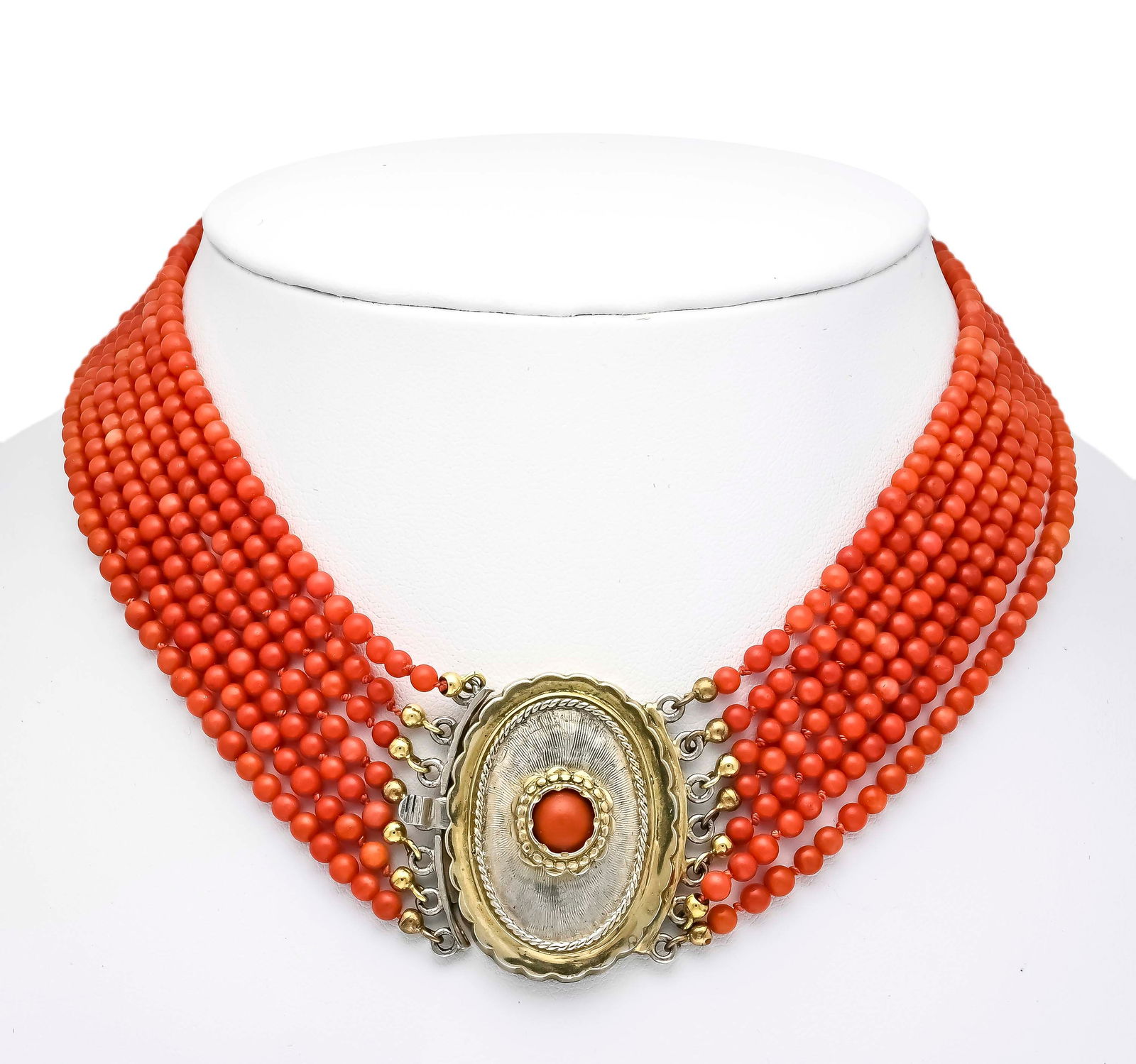 7-strand coral necklace with oval: 7-strand coral necklace with oval showpiece box clasp silver 800/000 partially gold-plated, set with a round coral cabochon 7 mm, l. x w. 36 x 26 mm, strands of coral beads 3 mm in orange-red, l. 37