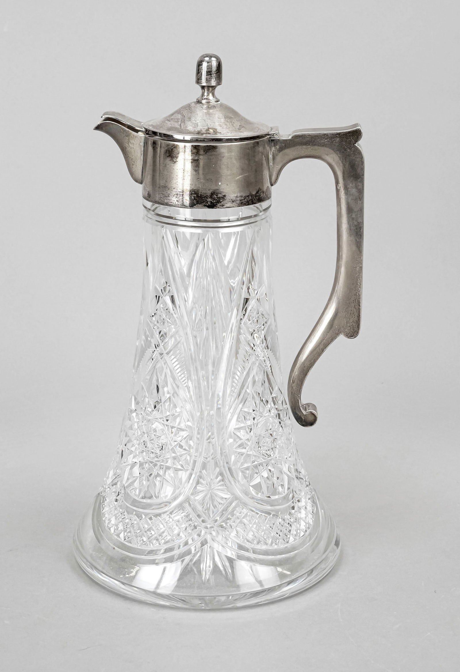 Pitcher with silver mounting, Ger: Pitcher with silver mounting, German, early 20th century, maker's mark Theodor Müller, Weimar, silver 800/000, hinged, domed hinged lid, angular handle, clear glass body with rich cut decoration, h.