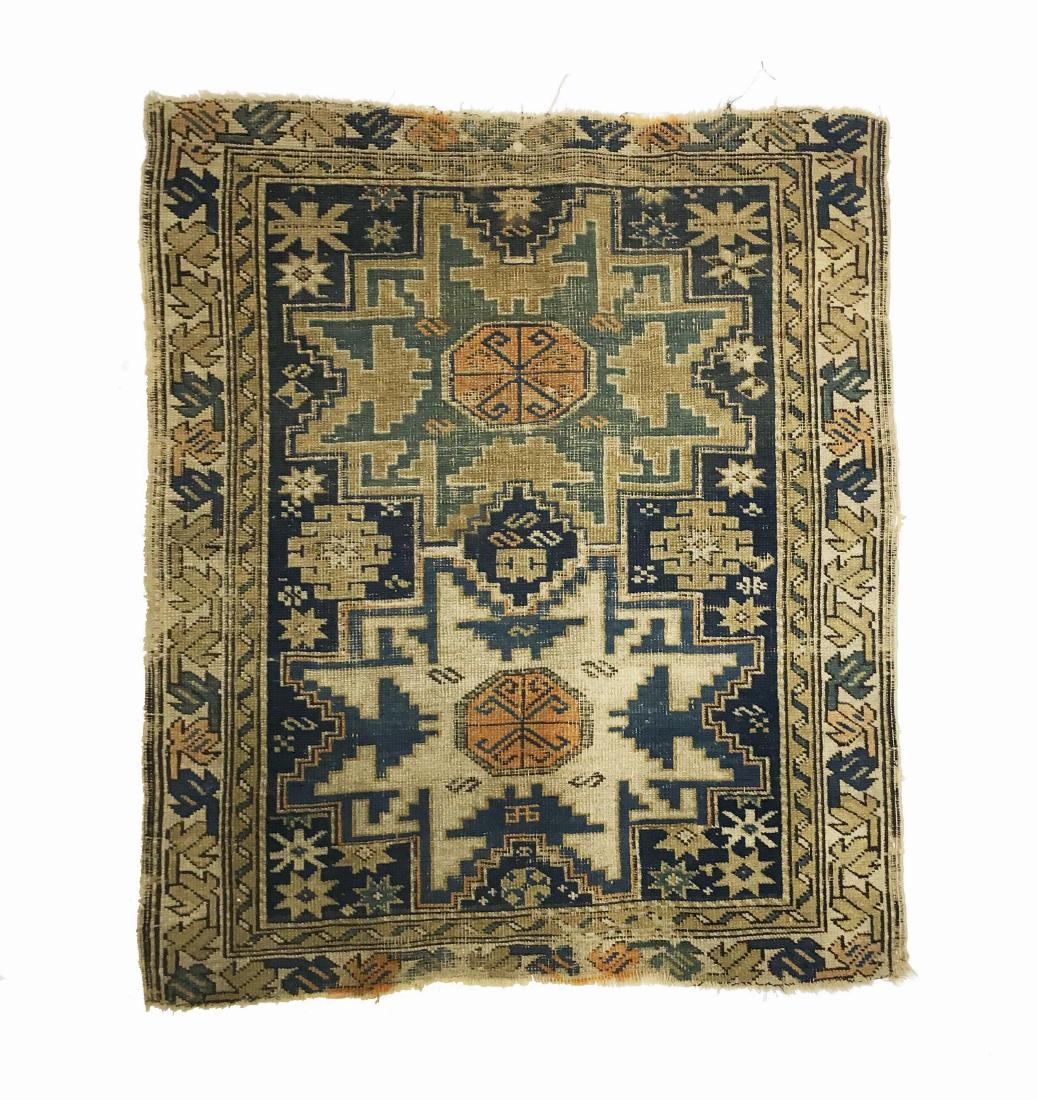 A Caucasian Wool Carpet: A Caucasian handmade carpet. W 27.5 in x L 32.5 in. Property from the Estate of Jane Rothschild