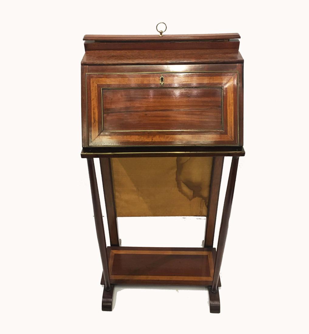 A Small Fold Down Writing Table with Drawers: A small fold down writing table with drawers. 20th century. H 40 in x W 19 in.