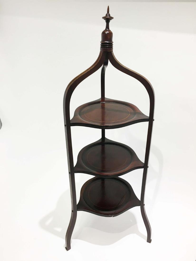 English Three-Tiered Wooden Side Table: English three-tiered wooden side table. Height 38.5 in. Property from the Estate of Jane Rothschild