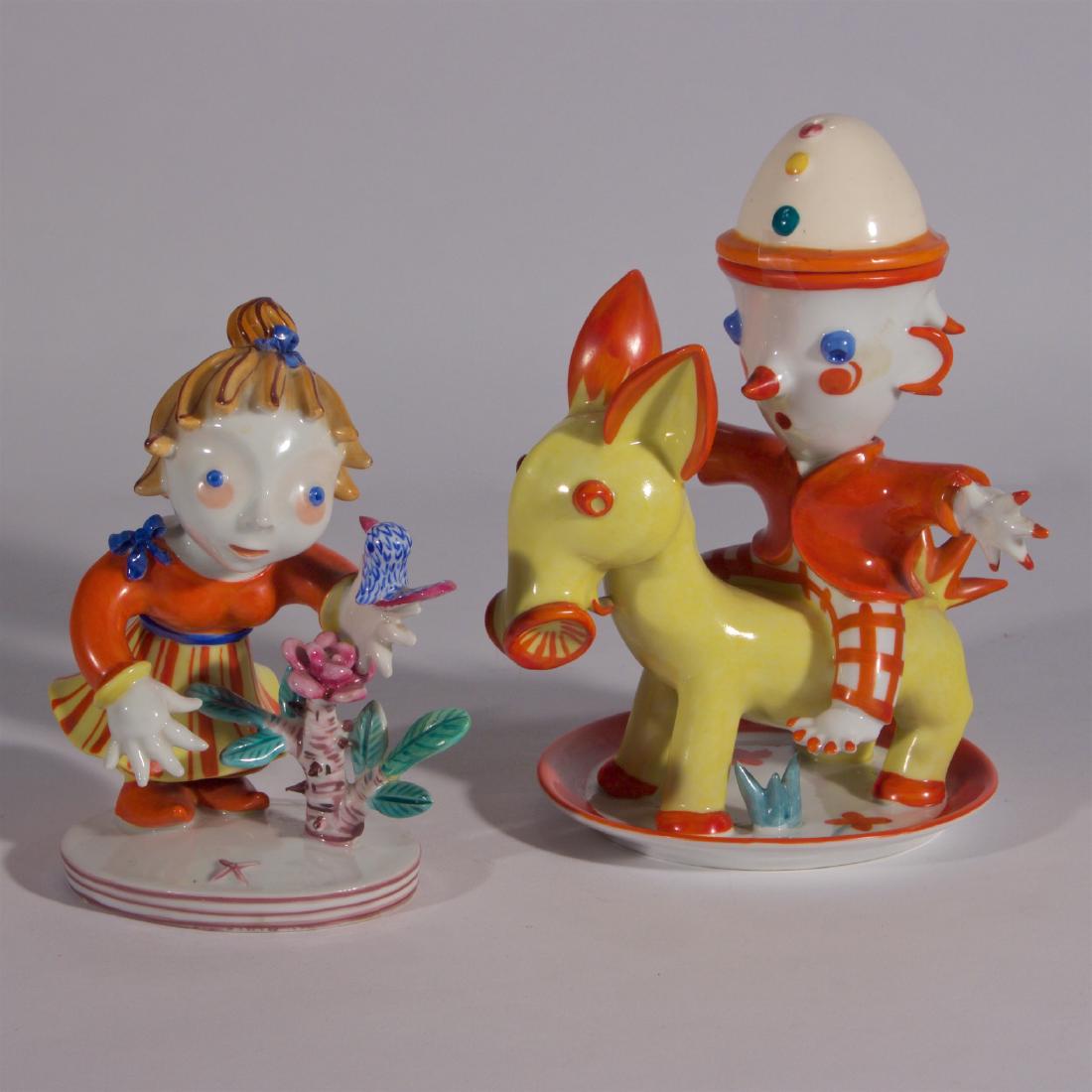Walter Bosse for Metzler & Ortloff Austrian Porcelain: Wiener-Werkstadd Style, Boy Riding the Donkey: The top hat removes to reveal an egg cup. Condition: the girl has one finger repaired Taller: 7 1/8 inches.