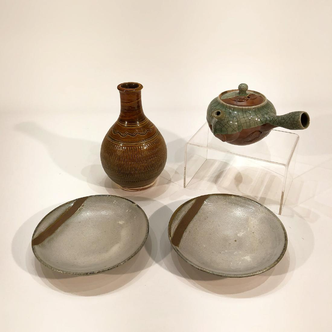 Japanese Ceramic Onta Vase, Tea Kettle and Plates: 4 Japanese ceramic Onta vase, tea kettle and plates. Plate diameter 6 inches. Vase height 6.8 inches.