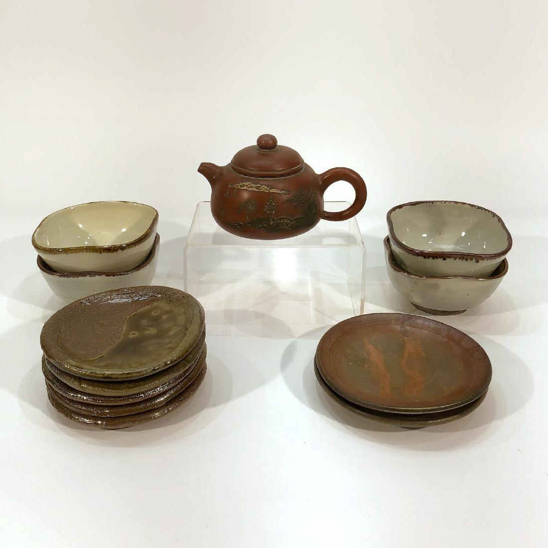 Chinese Ceramic Tea Kettle, Square Bowls and Round: Chinese ceramic tea kettle, square bowls and round plates. Tea kettle height: 3.25 inches. Pair of brick-colored plates: 5.25 inches. 5 matte and glossy plates: diameter 4.75 inches.