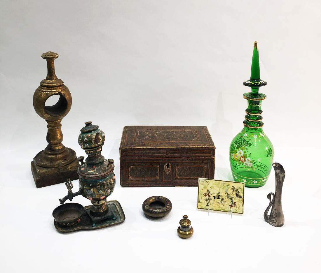 Assorted Lot of Middle Eastern Antiques: A group of 8 Persian assorted Persian antiques. A wooden box with detailed inlay: 12.75 in x 8 in x 5.5 in. Enameled green jar with lid: 19.25 inches tall. Tea set with enameling. Wooden sculpture, an