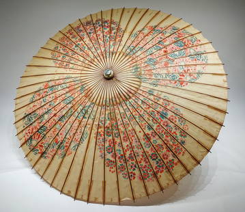 A Japanese Large Paper Umbrella: A Japanese large paper umbrella. Good condition with some minor tearing to paper.