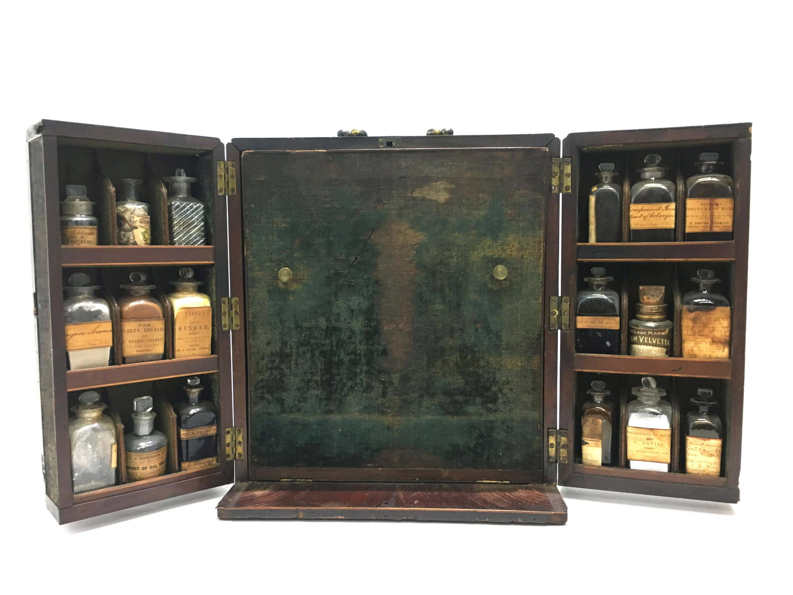 Antique Apothecary Chemists Medicine Chest: Late 18th century English mahogany medicine chest. Trunk-like box with open double fronted cupboards. Bottles fitted in both doors and central part. Brass drop handle. Original medicine glass jars and