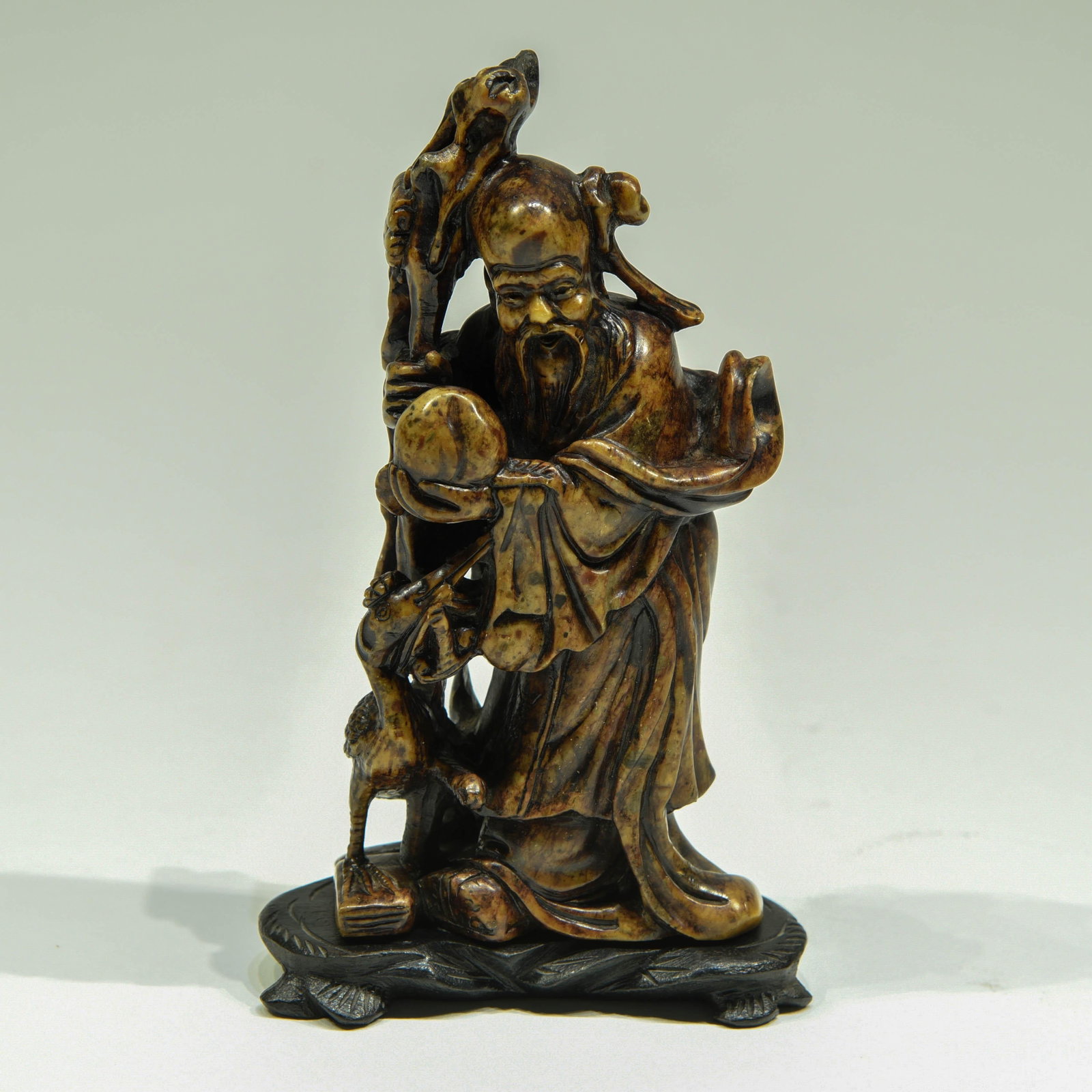 Chinese Hard-stone Stone Carving of Shou (longevity): A Chinese hard-stone carving of the deity Shou. The star of Shou, Shouxing, Carinae (Canopus), the star of the south pole in Chinese astronomy, and is believed to control the life spans of mortals. Ac