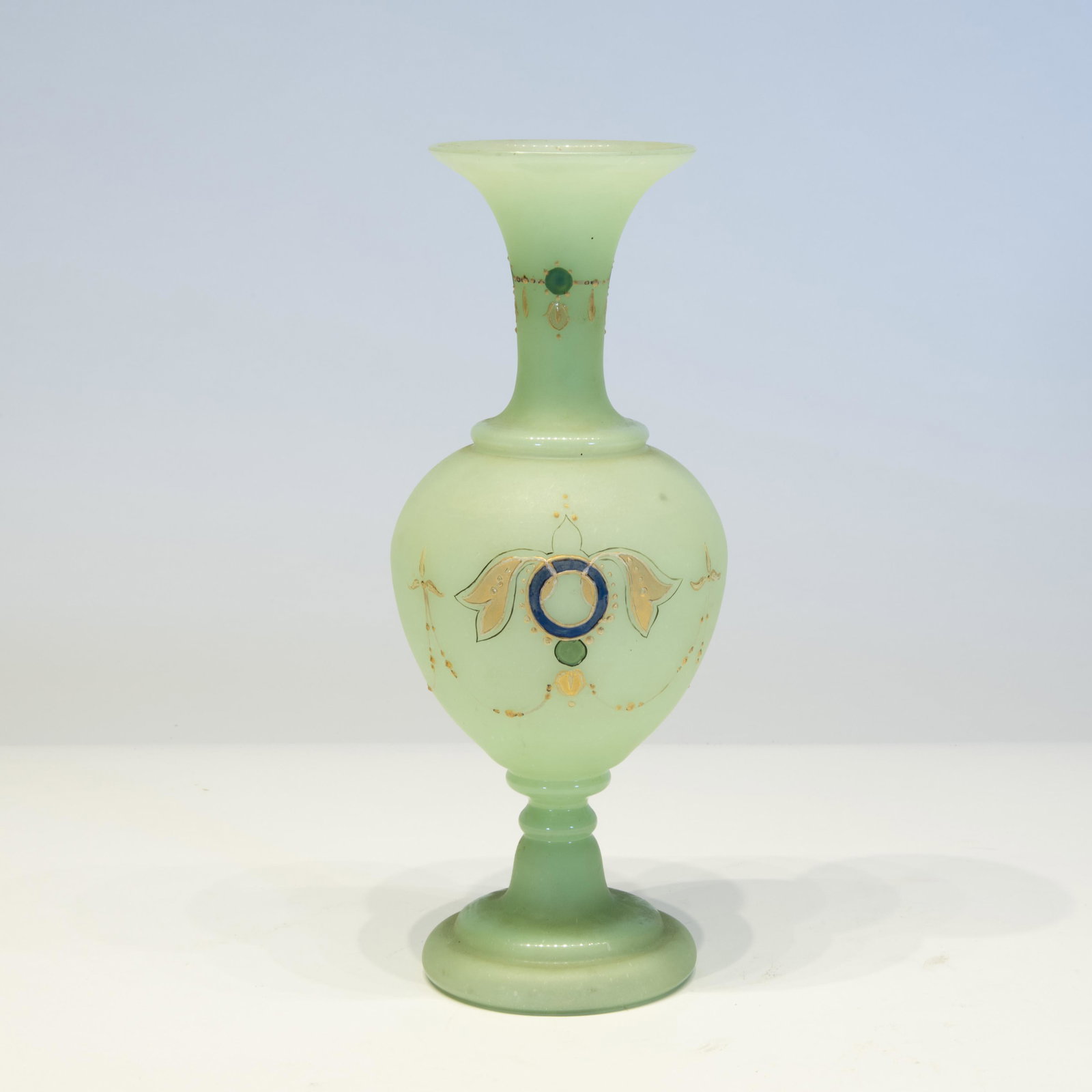 French Opaline Glass Vase: A French opaline glass vase with flared rim and enamel decoration. 19th century Height 10 1/2 inches. Property of a Long Island Estate.