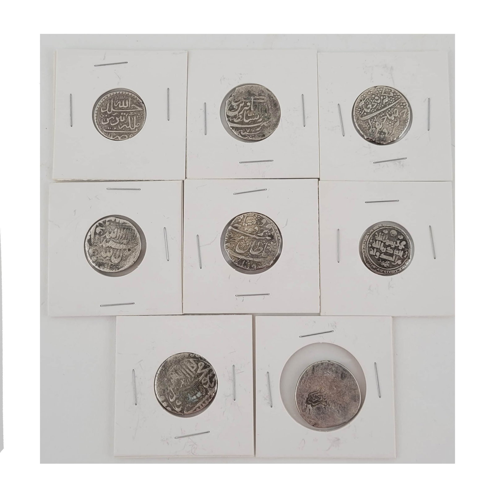 Eight Early Islamic Silver Coins: Persian, Indian silver coins 19th century and earlier. eight coins.