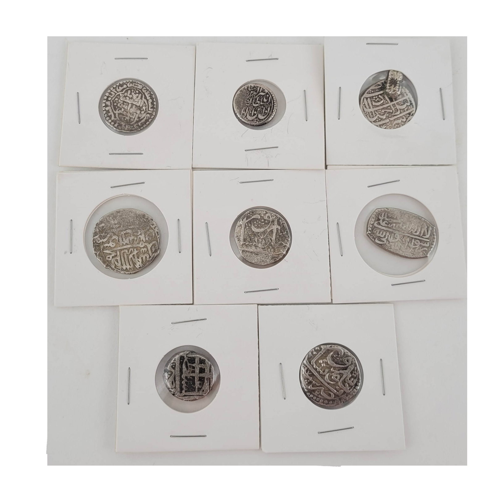 Eight Early Islamic Silver Coins: Persian, Indian silver coins 19th century and earlier. eight coins.