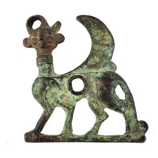 Luristan Bronze Cheekpiece: Luristan Bronze Cheekpiece in the form winged goat or ram. 4 1/2 x 4 1/4 x 1/2 inch