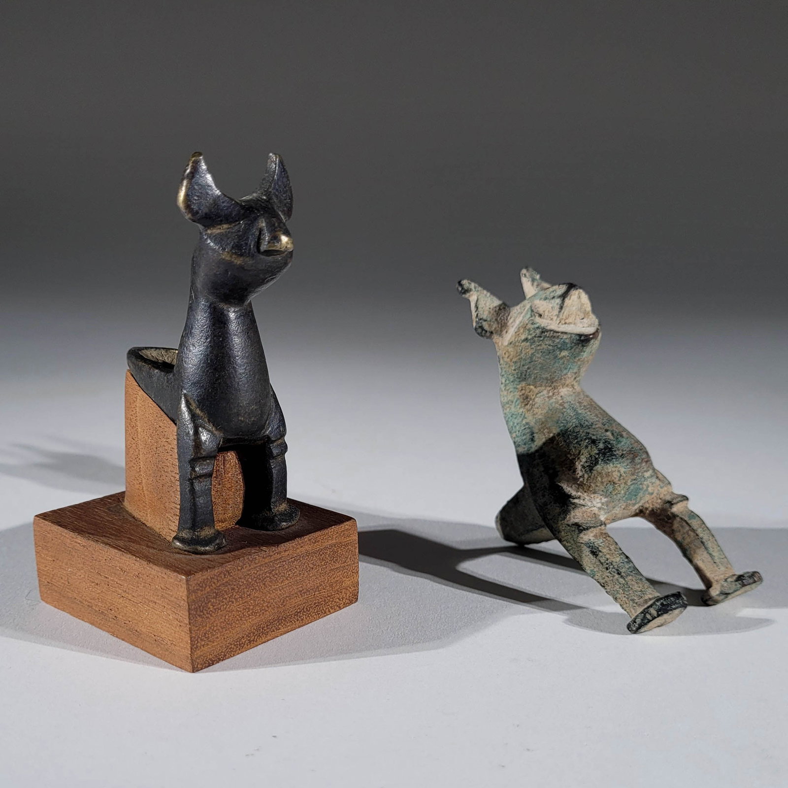 Two Seljuk Bronze Support Legs in Form of Felines: Two Seljuk bronze support legs in the form of felines. One custom mounted with dark black patina. The largest piece measures 3 x 1.25 x 1.65 inches. Property from the Estate of Richard Ettinghausen.