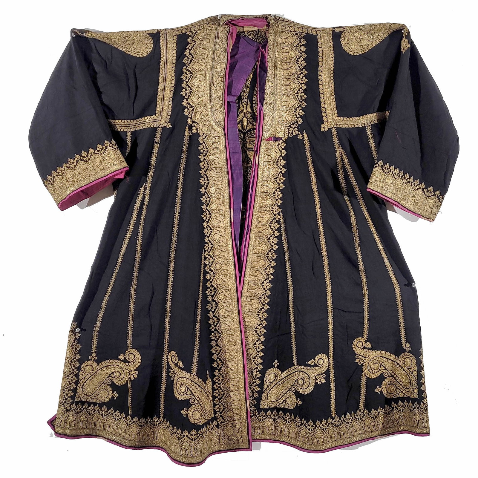 Kashmiri Cotton Kaftan with Dense Gold Thread Embroidery: Black cotton Kashmiri kaftan with dense gold thread embroidery. The kaftan is open with embroidery in boteh and crown designs on the front, back, sleeves, and bottom. Aubergine silk lining. Small hole