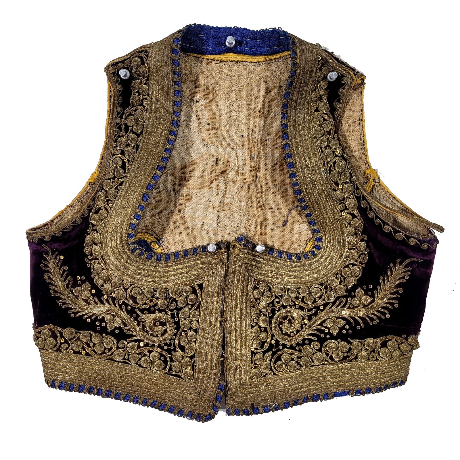 Ottoman Velvet Yelek/Women's Vest: Traditional Ottoman yelek women's vest. The vest is heavily adorned with metallic gold and sequined embroidery. A section of embroidered lining is partially unseamed from the vest. Plum colored. 19th