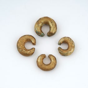 Lot of Four Pre-Columbian Gilded Bronze Nose Rings