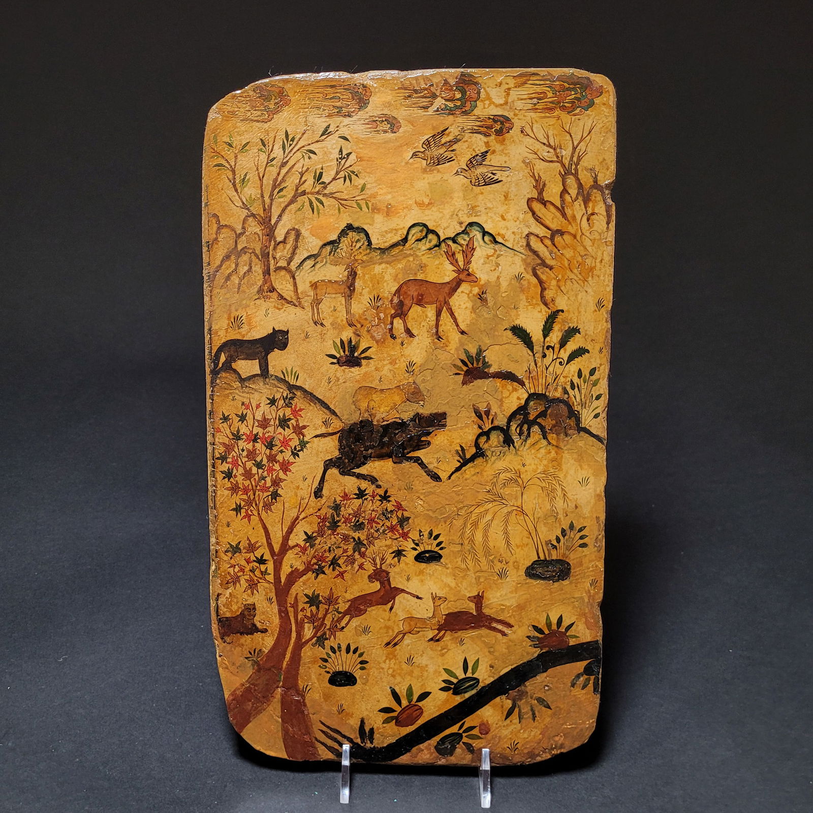 Safavid Persian Lacquered Papier-mache Book Cover: Safavid Persian lacquered papier-mache book cover. The cover features multiple scenes of deer and other fauna frolicking against a landscape. Tempura has been restored. 16th-17th century. Dimensions: