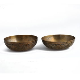 Two Persian Copper Dishes with Silver Coins