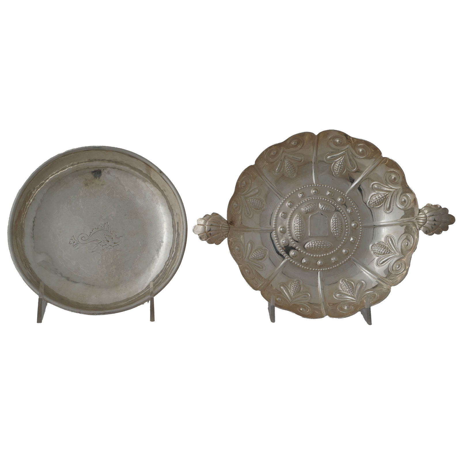 Lot of Two Sterling Silver Plates: Lot of two continental silver decorative plates. One is hand-hammered and marked David Ferreira Porto. The other is Spanish colonial-style with a makers marks on its back. Dimensions: 9 x 6 1/2 inches