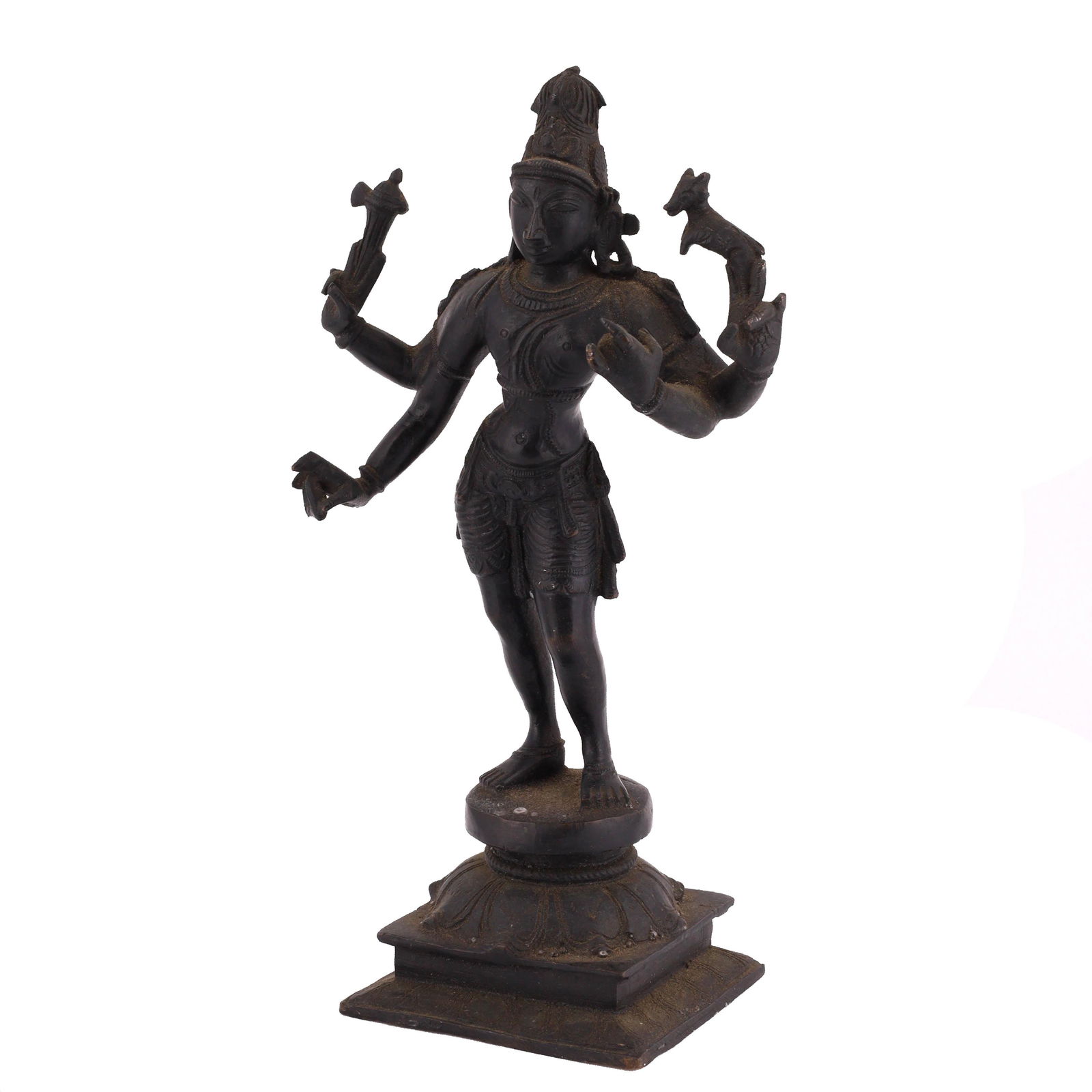 Indian Bronze Lord Shiva Figure: Indian bronze Lord Shiva figure. Shiva is sculpted with four arms holding various traditional elements atop a lotus pedestal base. Dimensions: 9 x 3 x 3 inches.