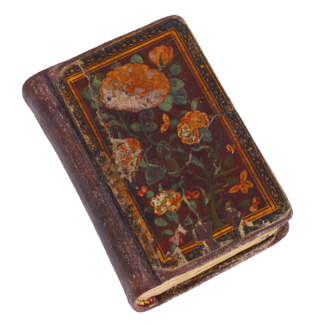 A Small Indian or Kashmiri Quran: A small Indian or Kashmiri illuminated quran with lacquered paper mache floral cover. 2 1/2 x 4 x 1 inches