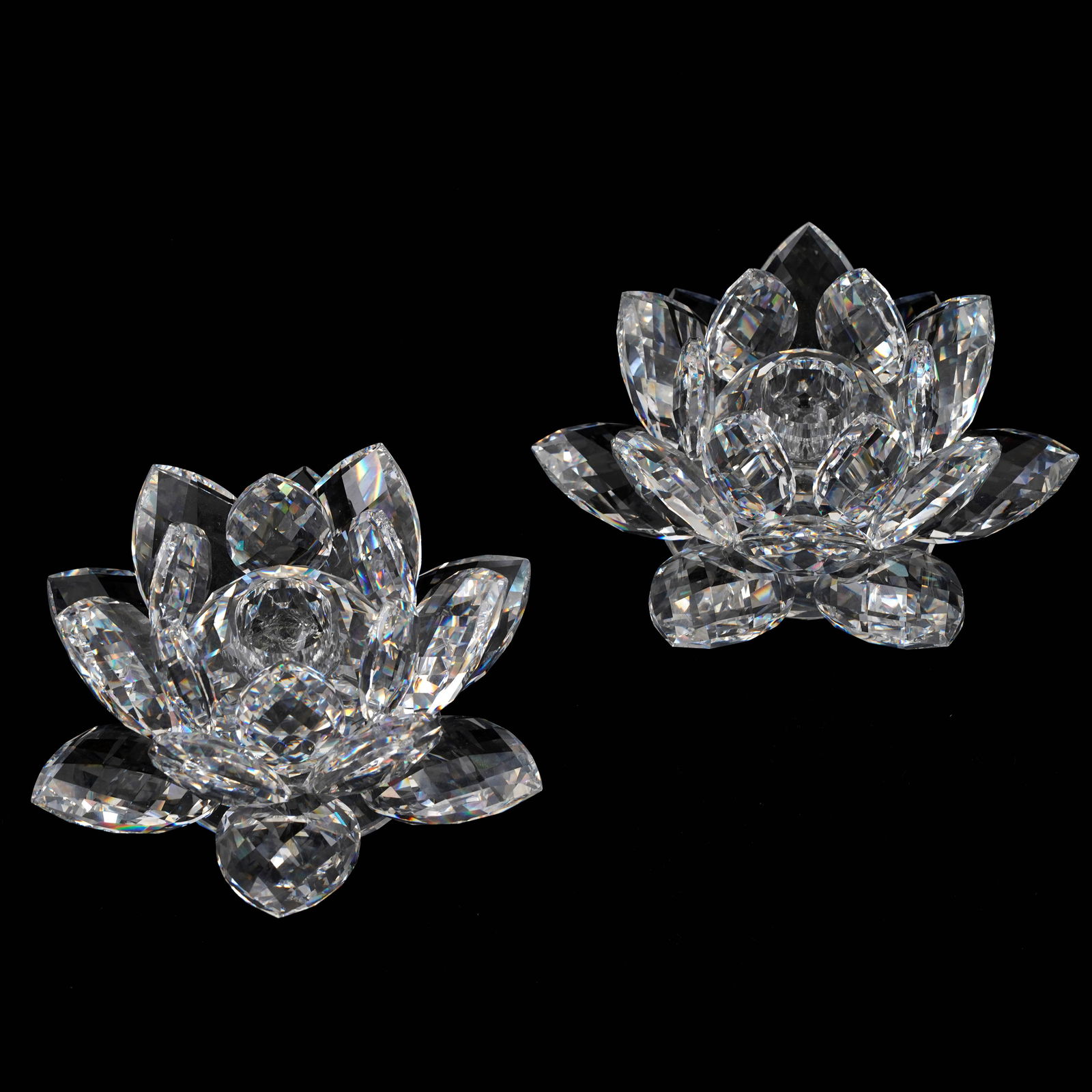 Pair of Swarovski Waterlily White Crystal Candle Holders: Pair of Swarovski waterlily white crystal candle holders. Excellent condition. Makers mark on bottom. Dimensions: 3 x 5 inches.
