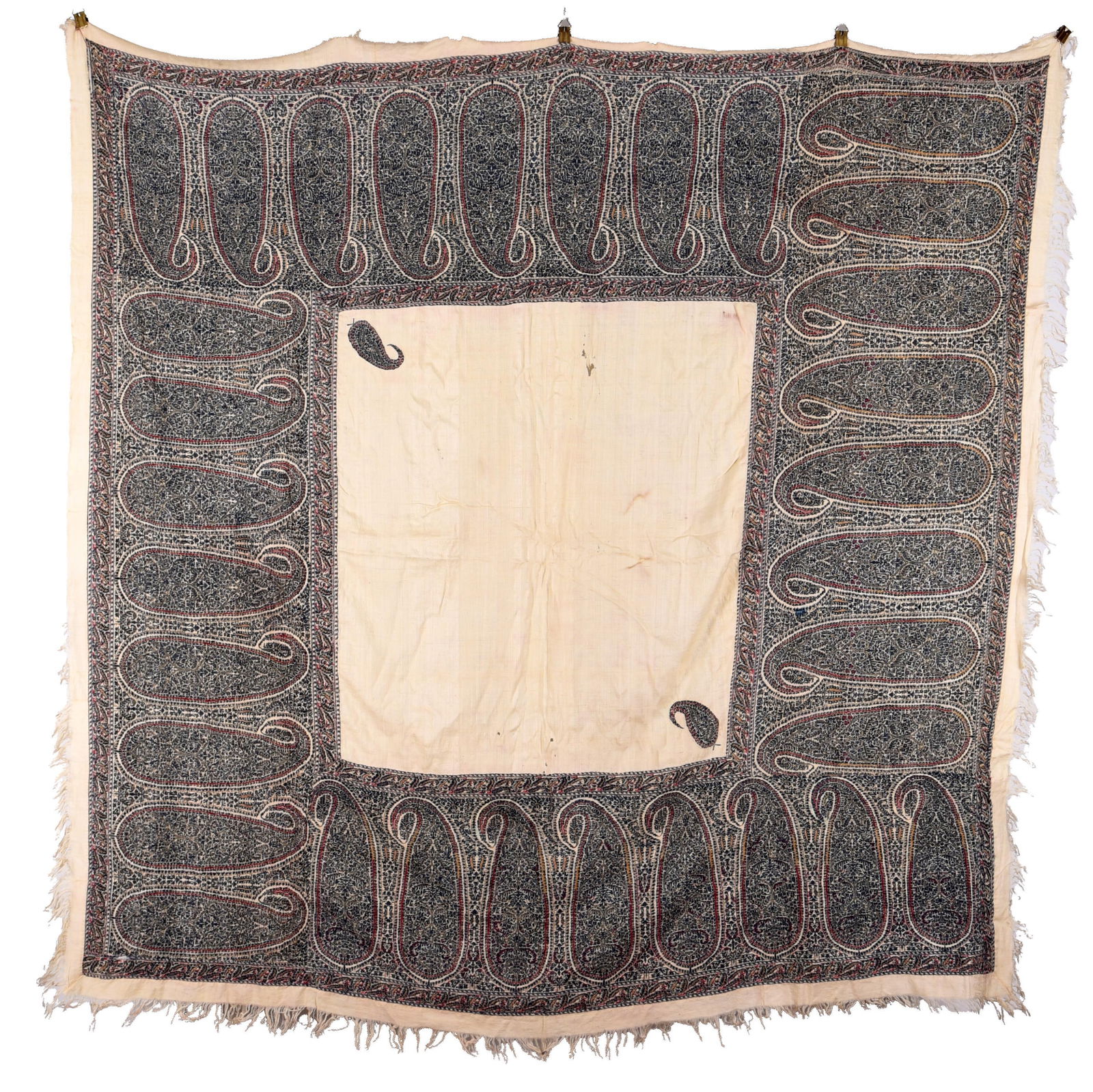 Square Silk Kashmiri Shawl: Square silk Kashmiri shawl. On an off-white ground, large boteh leaves are embroidered with crimson and navy thread. The edges are lined with tassels. Early 19th century. Dimensions: 68 inches.