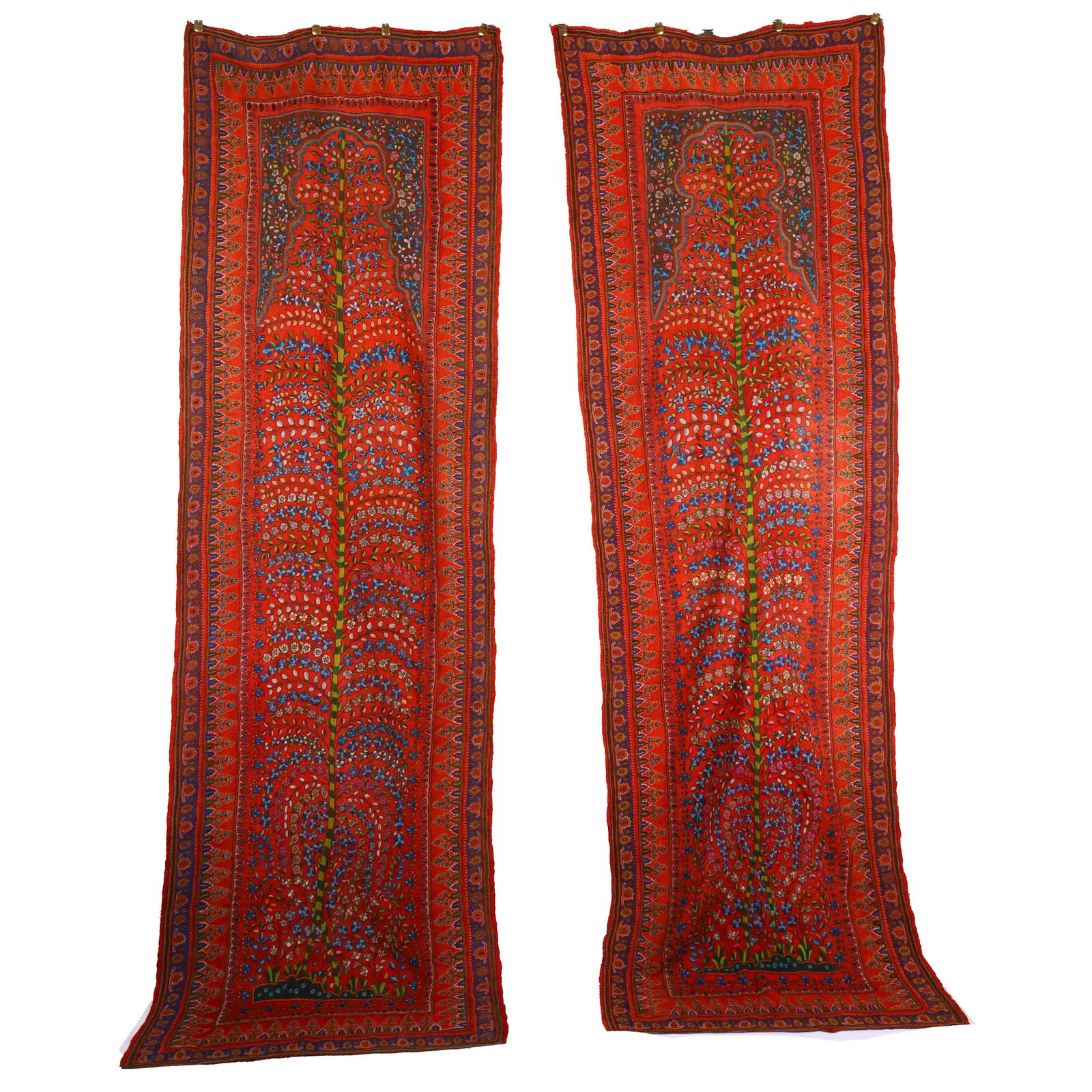 Pair of Long Kerman Pateh Wall Tapestries: Pair of long Kerman pateh wall tapestries. In the center of each tapestry, a spindly Tree of Life grows upwards, hand-embroidered in green. 19th century. Dimensions: 112 x 35 inches (each).