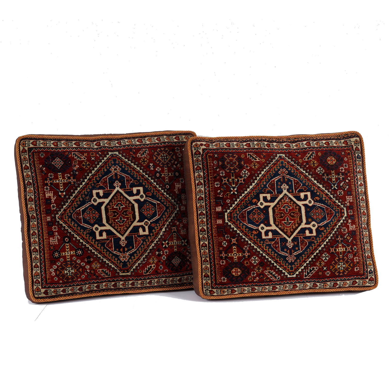 Pair of Persian Qashqai Cushions/Pillow Cases: Pair of Persian Qashqai cushions/pillow cases. The lot's pattern feature traditional hooked and cross-like motifs. Dimensions: 23 x 26 x 7 inches.
